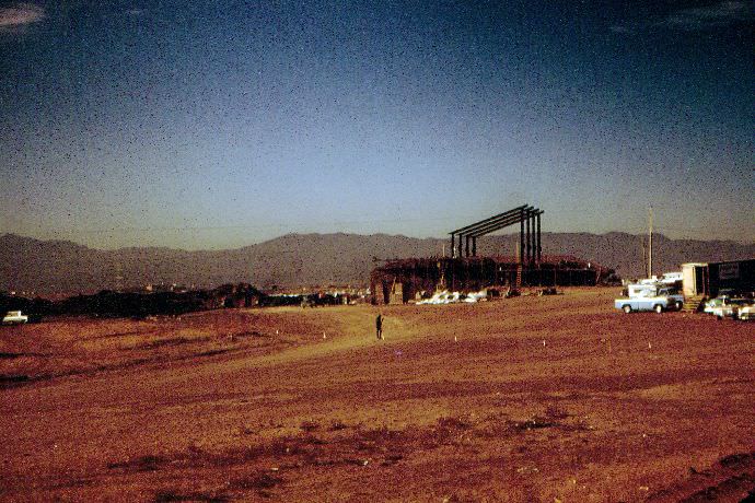 The skeleton of the top of the administration building is being built in this shot.