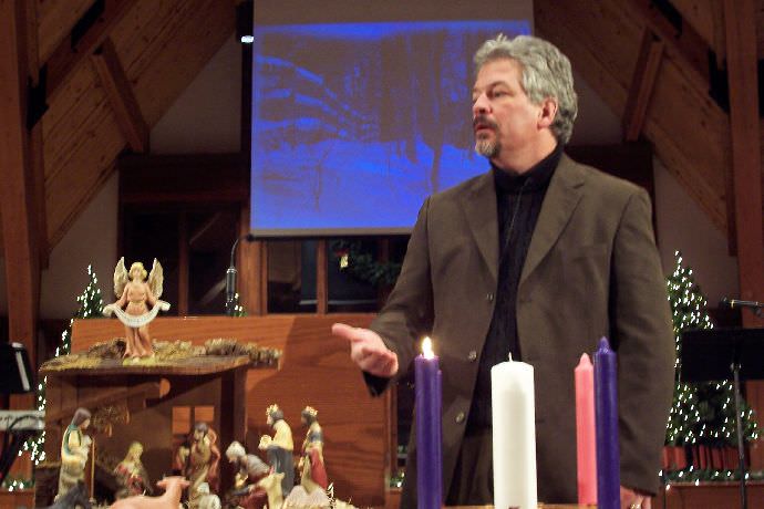 Chaplain Alan Lyke preaching during Christmas in Strickland Chapel.