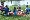 Students and their families gather water-side during a NBC picnic.