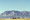 This is an old photo of Cheyenne Mountain and NORAD with the Nazarene Bible College in the foregrou