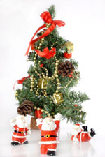 A Christmas tree with three Santas