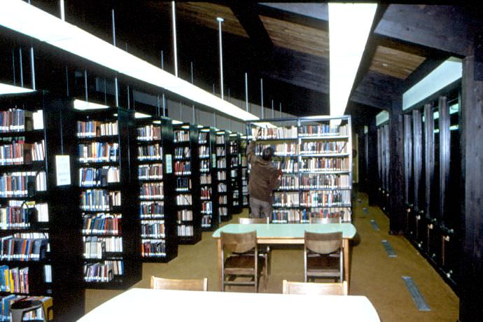 Early shot from inside Trimble Library. Notice the dark colored shelving.